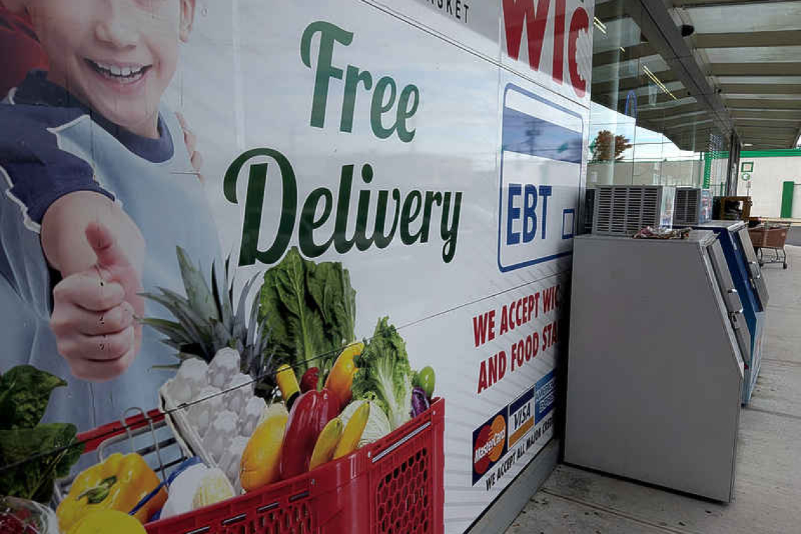 US to pay reduced food aid benefits,  but warns of weeks or months delay